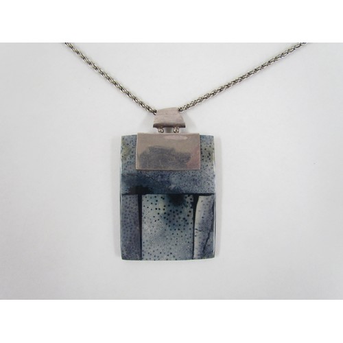 7265 - A contemporary rectangular shell pendant with sterling silver chain and mount marked 925