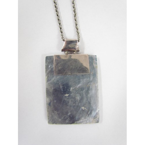 7265 - A contemporary rectangular shell pendant with sterling silver chain and mount marked 925