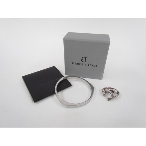 7252 - An Abbott Lyon boxed contemporary modernist bangle in original box and a West German sterling silver... 