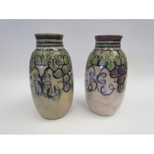 1184 - A pair of Royal Doulton Lambeth vases by Florrie Jones