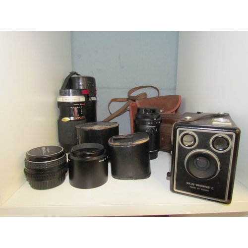1235 - A group of vintage camera's and lenses including an Anastigmat Firetar, Kodak Six-20 Brownie C, Asah... 