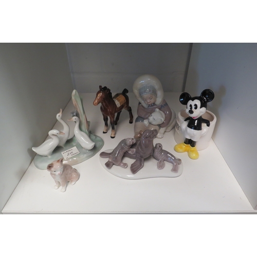 1350 - A Lladro Eskimo figure, seals, Nao geese, Beswick foal and Disney Mickey Mouse (6)