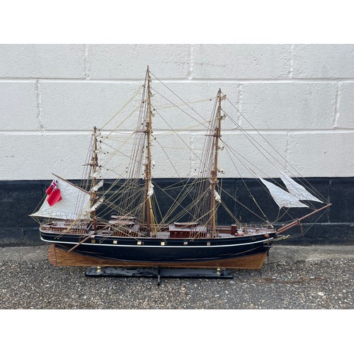 8012 - A model of the Cutty Sark, black lacquered and copper hull, 118cm long x 81cm high