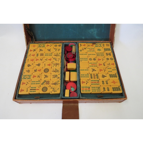 1464 - A leather cased mahjong set with 148 blocks, some cracked.  Wushunsing to case clasp