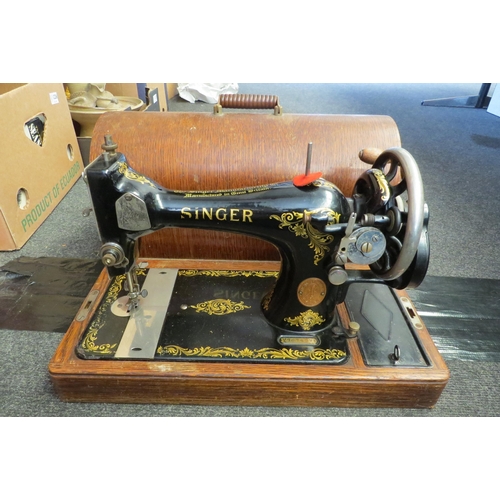 1219 - An oak cased Singer sewing machine   (E) £10-15