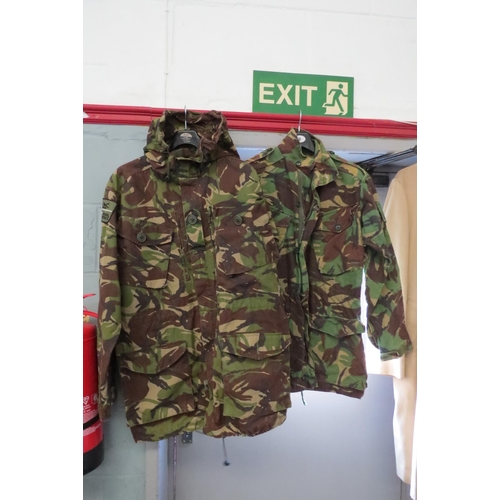1229 - Five Army jackets, two Webbing jackets, trousers, camouflage and backpack