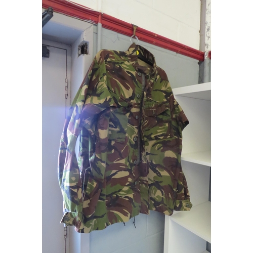 1229 - Five Army jackets, two Webbing jackets, trousers, camouflage and backpack