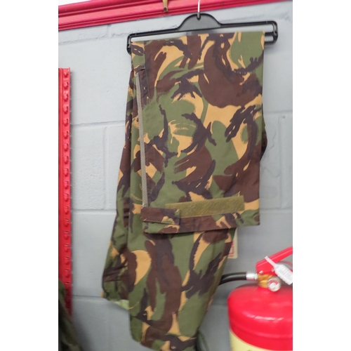 1229 - Five Army jackets, two Webbing jackets, trousers, camouflage and backpack