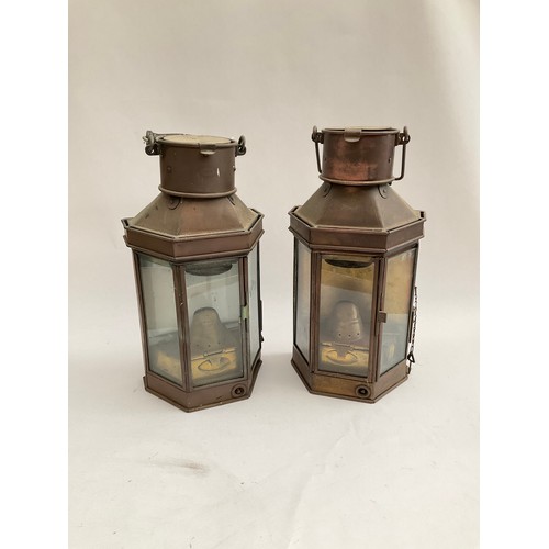 8096 - Two early 20th Century ship’s lanterns, faceted shape, one dated 1916, Bulpitt & Sons, 40cm high