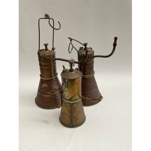 8023 - Three copper lamps, each with hooks for mounting