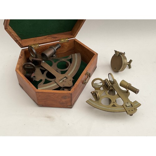 8057 - A reproduction brass sextant, cased, together with another and a pocket compass (3)