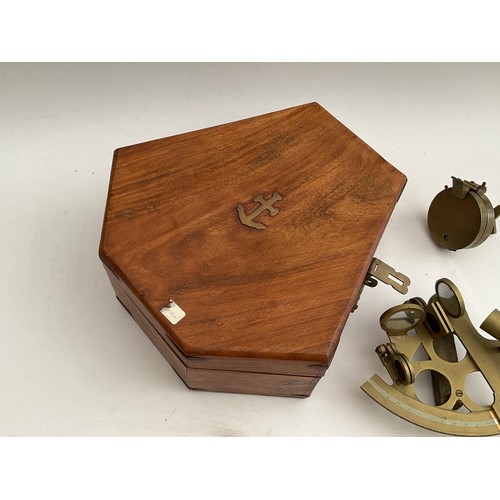 8057 - A reproduction brass sextant, cased, together with another and a pocket compass (3)