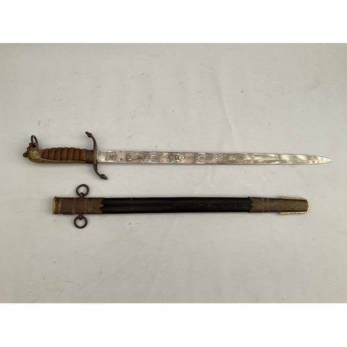 8087 - A replica of a Naval officer’s dirk, the blade maker Manton & Co. England, brass lion hilt, leather ... 