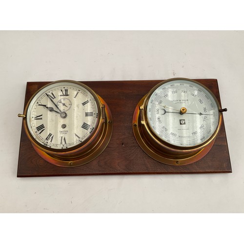 8059 - A Smith’s Empire ship’s clock together with Lilley & Gillie barometer, mounted on board