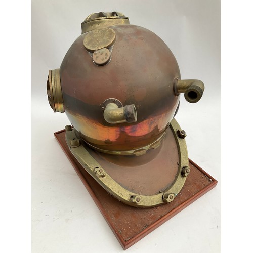 8091 - A reproduction brass and copper diving helmet, for decorative purposes