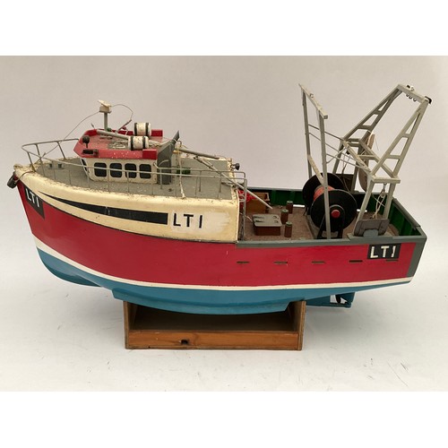 8128 - A model of a 20th Century fishing boat together with two others for restoration (3)