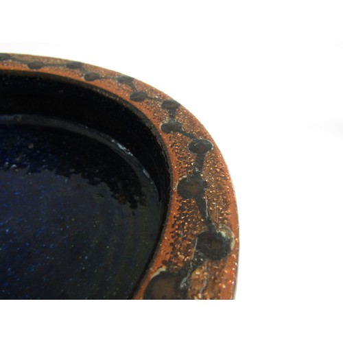 7024 - A Danish Soholm Stentoj stoneware bowl with blue glaze and 'Molecule' rim. Impressed marks to base. ... 