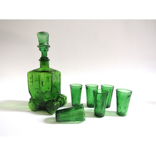 7173 - A Taiwanese 'Empoli' style green glass bottle decanter in the form of a car and driver, together wit... 