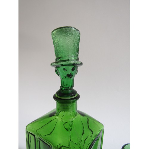 7173 - A Taiwanese 'Empoli' style green glass bottle decanter in the form of a car and driver, together wit... 