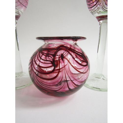 7169 - GEORGE ELLIOTT (1933-1998): Two studio blown wine glasses with pink combing technique pattern over a... 