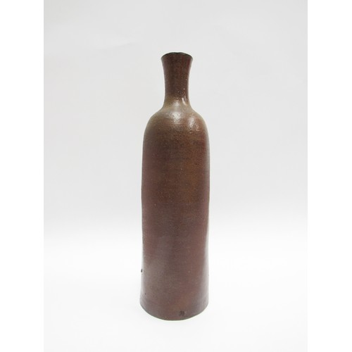 7060 - JOANNA CONSTANTINIDIS (1927-2000) A studio pottery early cylindrical vase, brown glazed.  Impressed ... 