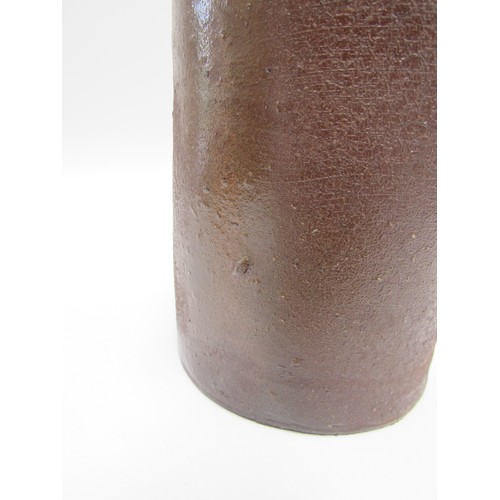 7060 - JOANNA CONSTANTINIDIS (1927-2000) A studio pottery early cylindrical vase, brown glazed.  Impressed ... 