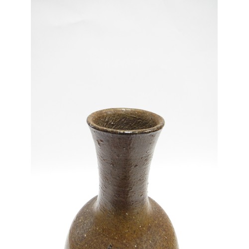 7060 - JOANNA CONSTANTINIDIS (1927-2000) A studio pottery early cylindrical vase, brown glazed.  Impressed ... 