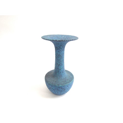 7056 - A studio ceramic flared vase with high fired volcanic blue glaze.  Unmarked 25.3cm high