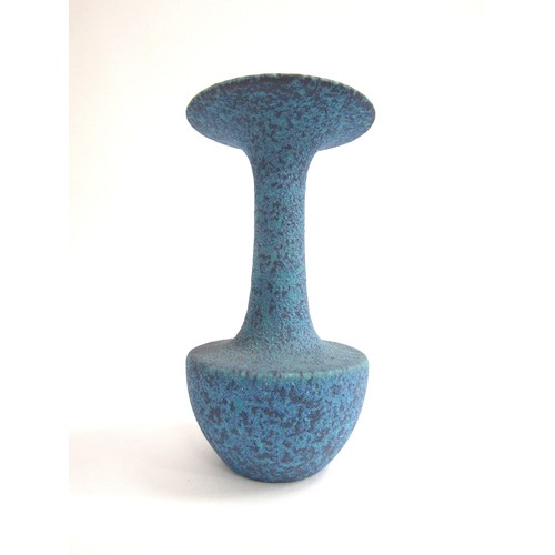 7056 - A studio ceramic flared vase with high fired volcanic blue glaze.  Unmarked 25.3cm high