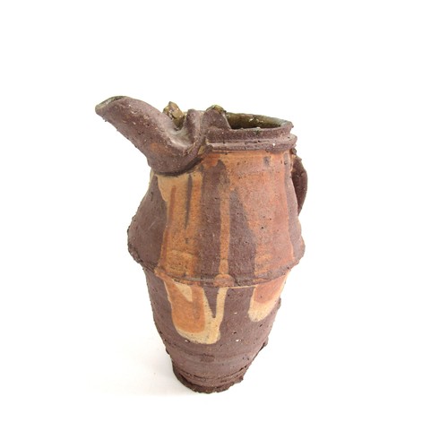 7059 - PETER SMITH (b.1941) A studio pottery earthenware jug, rough textured with poured slip detail. Impre... 