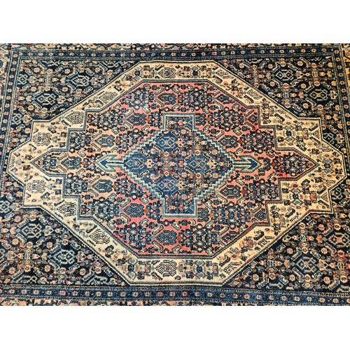 4491 - A blue ground geometric design rug with multiple borders, 127cm x 160cm