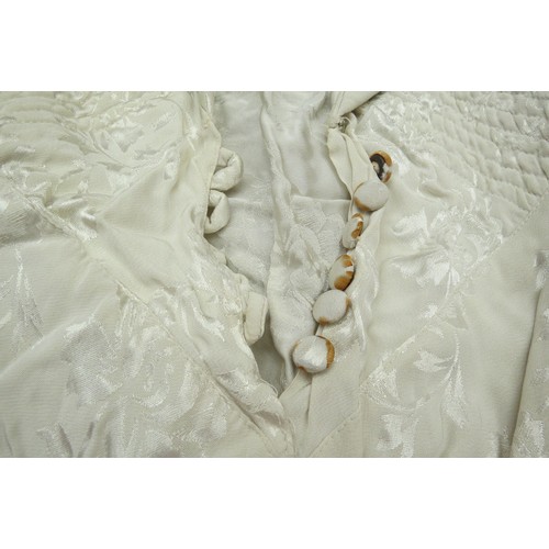 6026 - A 1930's bridal veil with a waxed headdress together with two 1930's wedding dresses