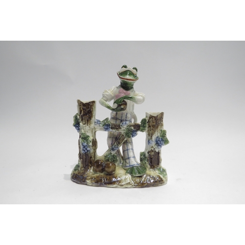 4426 - An Edwardian Continental porcelain figure of a frog playing bowls, 16.5cm tall