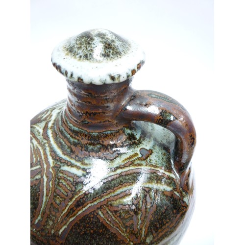 7075 - An Abuja Pottery stoneware flagon with screw top in the Michael Cardew tradition, strap handle. Iron... 