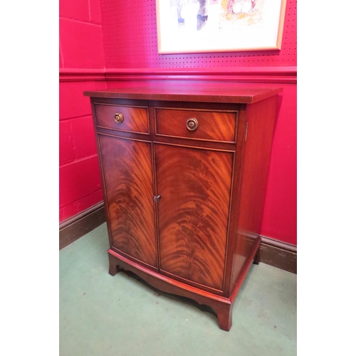 4103 - A 'Bevan and Funnell' George III style flame mahogany bow front media cabinet, the rising top over t... 