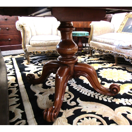 4075 - A Circa 1860 mid-Victorian burr walnut oval tilt-top table over a baluster turned column base and ca... 