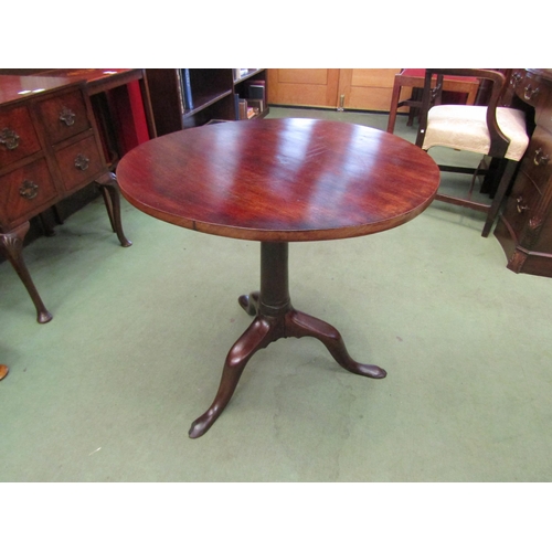 4087 - A George III circular tilt-top wine table on a cannon barrel turned column and tripod base, 69cm tal... 