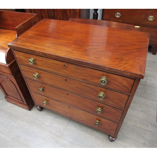 4092 - A Circa 1830 flame mahogany chest of four graduating long drawers with ebony lined inlay, the decora... 