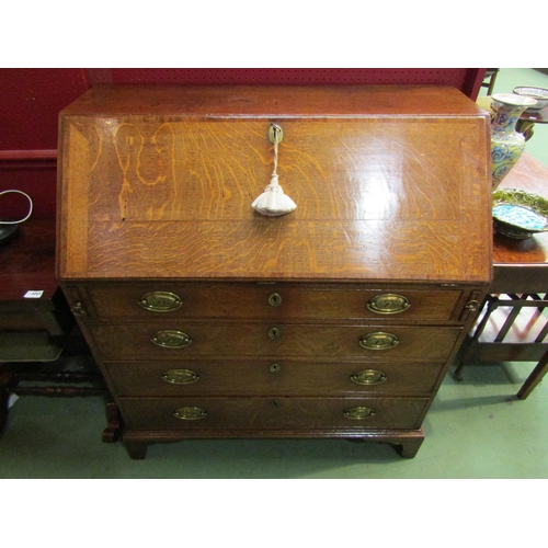 4109 - A circa 1780 North Country George III English oak with crossbanded mahogany bureau, the fall with ke... 