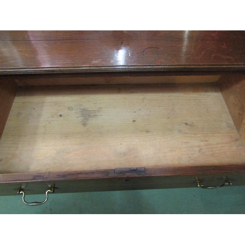 4131 - A Circa 1840 planked oak chest of three graduating long drawers with brass swan neck handles over br... 