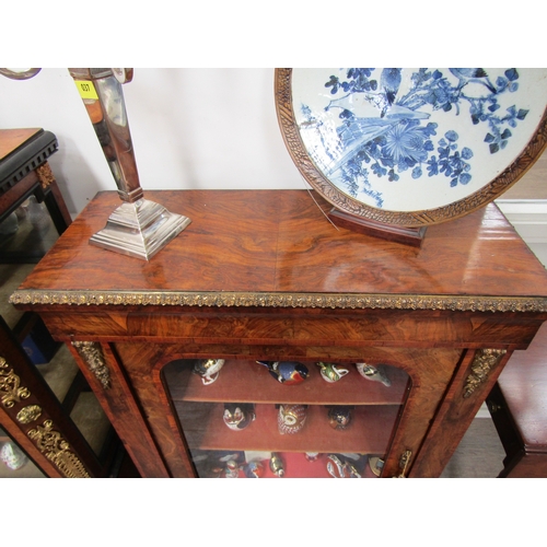 4135 - A Victorian walnut display cabinet, ormolu mounts, single glazed door, lined shelves, shaped plinth ... 