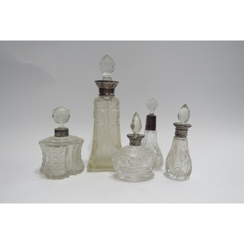 4357 - Five silver collared scent bottles of varying forms  (R)  £35