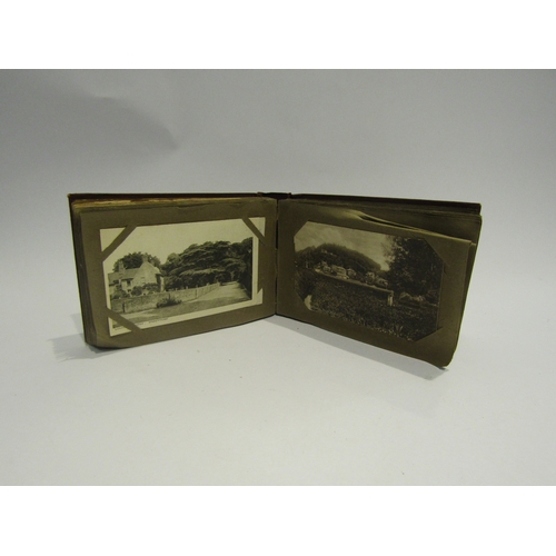 4318 - A postcard album containing written cards of the Somme, WWI scenes, village scenes, some coloured so... 