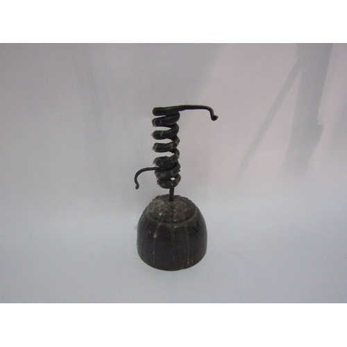 4309 - A circa 19th Century pigtail spiral candlestick on turned wooden base, 19cm height