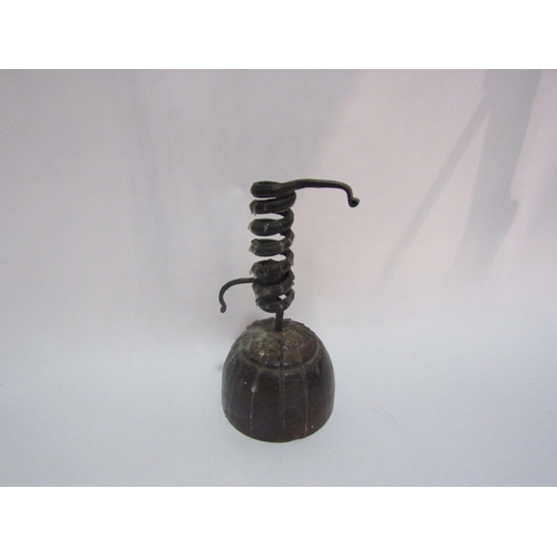 4309 - A circa 19th Century pigtail spiral candlestick on turned wooden base, 19cm height