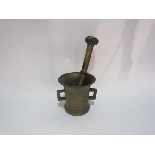 4308 - A brass pestle and mortar