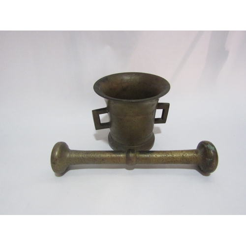 4308 - A brass pestle and mortar