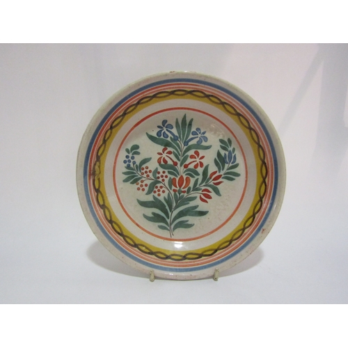 4293 - A French faience pottery bowl with floral central decoration and banded rim.  20cm diameter.  Stampe... 