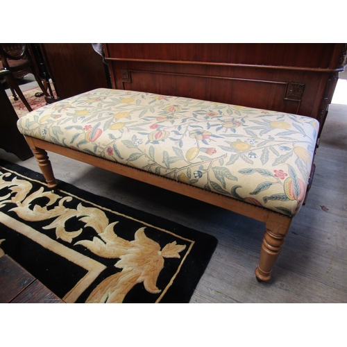 4189 - A circa 1900 pine and fruitwood upholstered duet stool over turned and tapering legs on brass and ir... 