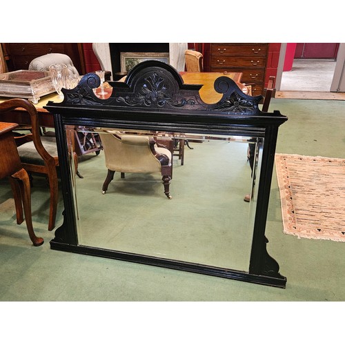 4197 - A late Victorian ebonised over mantel mirror with decorative bevel edge and carved frame, 106cm tall... 